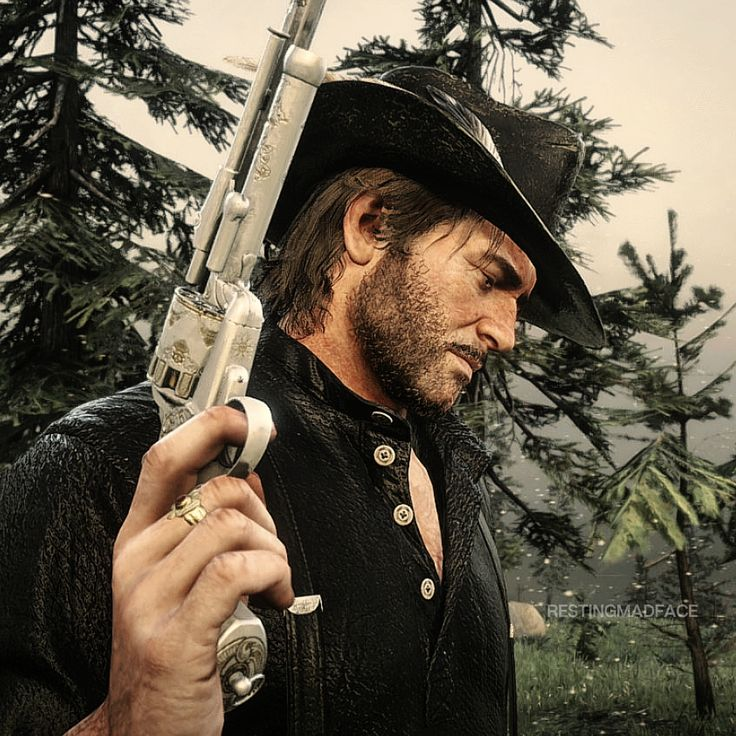 Arthur Morgan resting a rifle on his shoulder in pine country