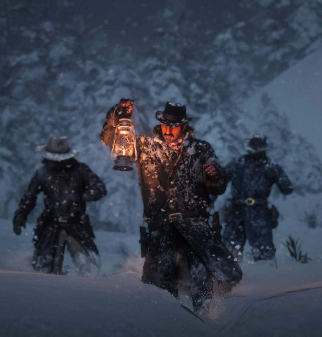 The gang trudging through the snow with a lantern in Colter