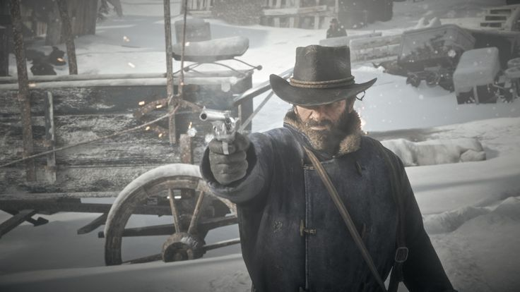 Arthur Morgan drawing a revolver in a snowy frontier town